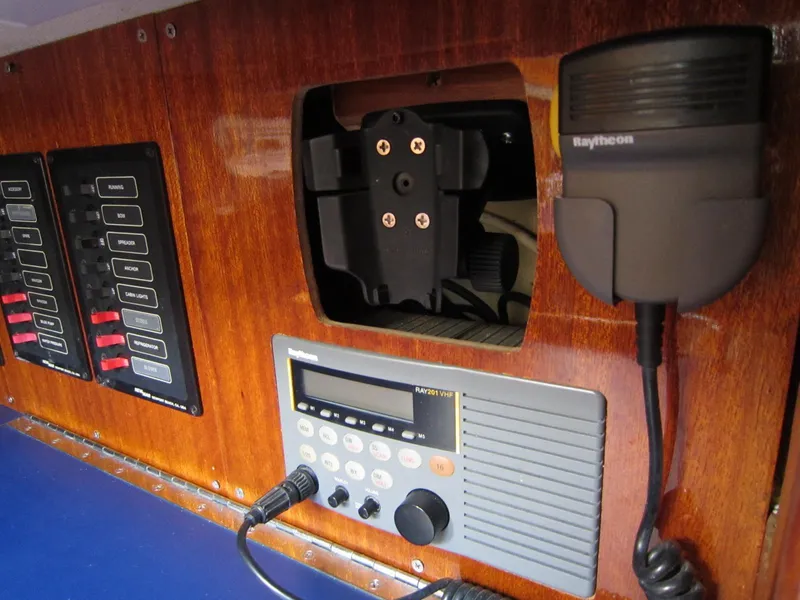 Slide: The Image of Control panel of a 1969 Chris-Craft Apache 37 boat with radio and switches. - 32