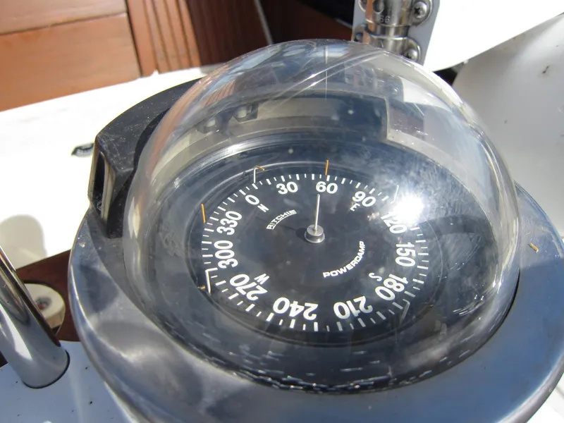 Slide: The Image of Compass on 1969 Chris-Craft Apache 37 boat, showing navigation directions. - 9