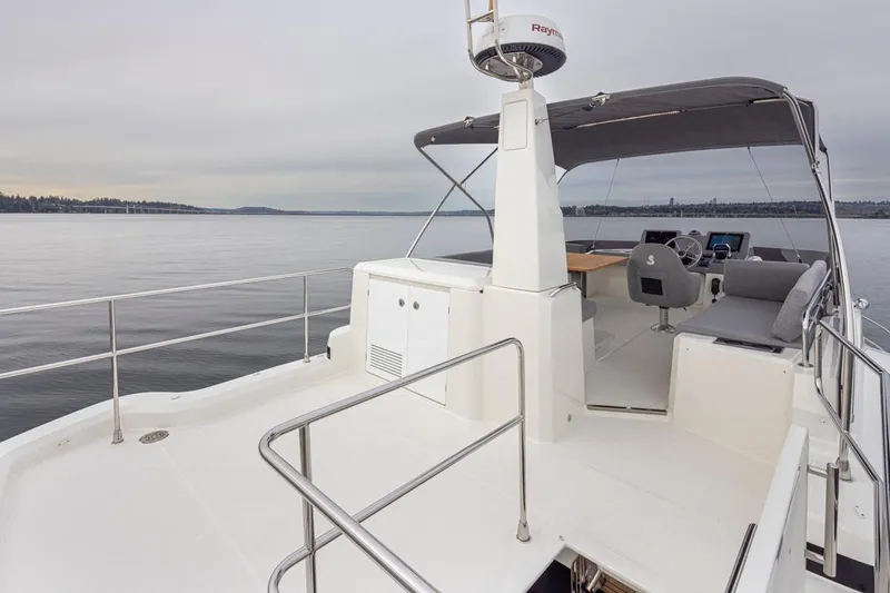 Slide: The Image of 2026 Beneteau Swift Trawler 41 Flybridge, featuring spacious deck and modern helm. - 24