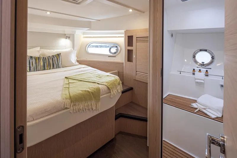 Slide: The Image of Luxurious cabin interior of 2026 Beneteau Swift Trawler 41 Fly with cozy bed and modern bathroom. - 28