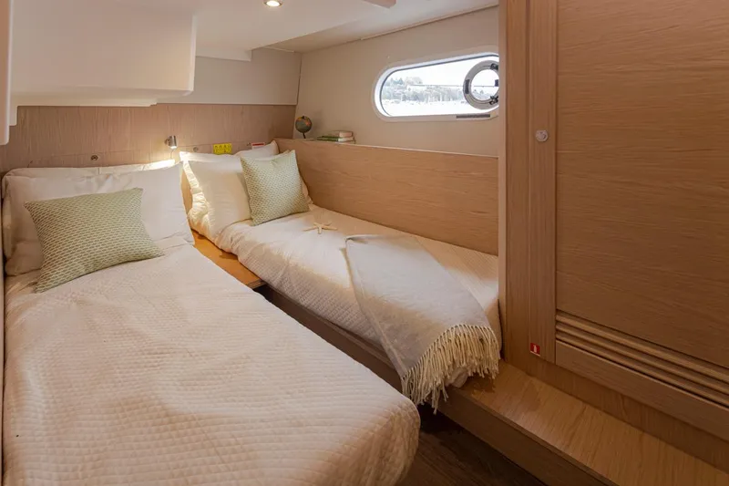 Slide: The Image of Cozy twin cabin in 2026 Beneteau Swift Trawler 41 Fly, featuring modern design and soft lighting. - 35