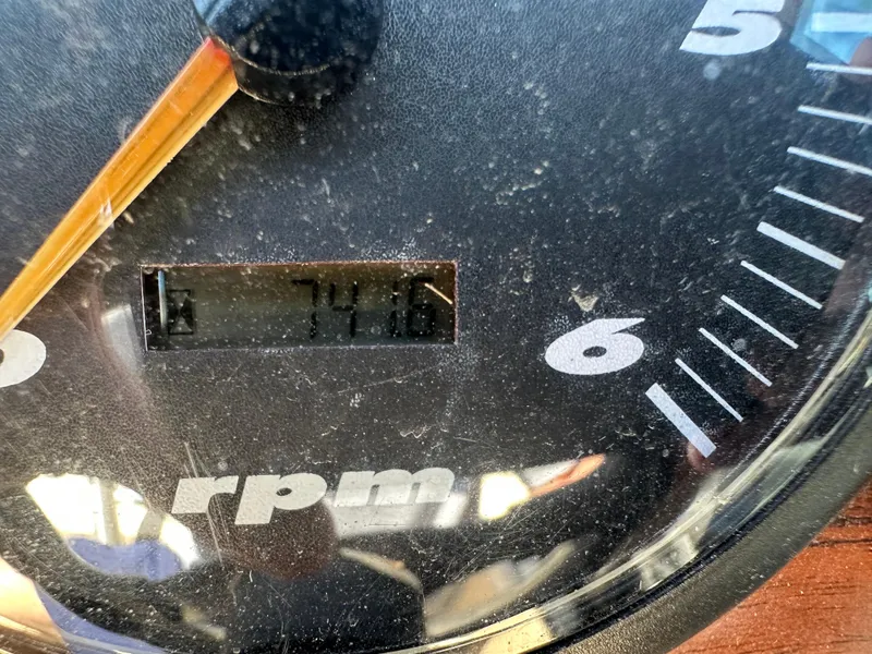 Slide: The Image of Close-up of a 1999 Malibu 20 Response LX RPM gauge displaying 741.6 hours. - 5