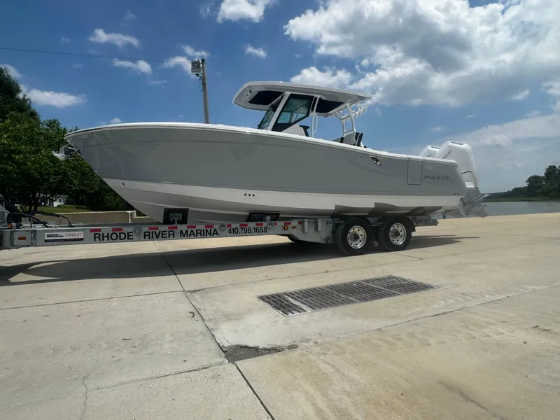 Slide: The Image of 2025 Blackfin 302 CC boat on a trailer at Rhode River Marina. - 10