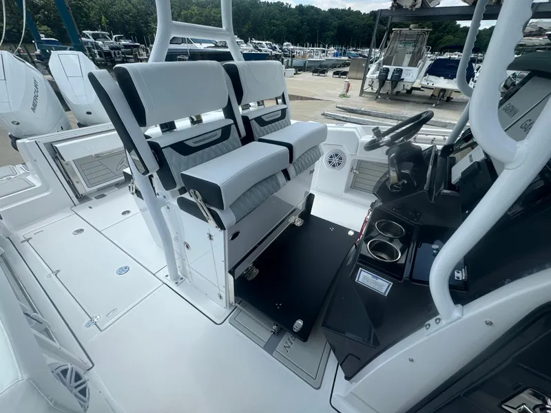 Slide: The Image of 2025 Blackfin 302 CC center console boat interior with dual helm seats and steering console. - 19