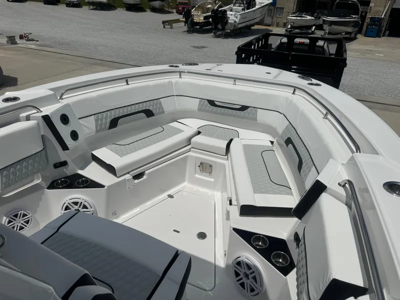 Slide: The Image of 2025 Blackfin 302 CC boat interior with white and gray seating. - 20