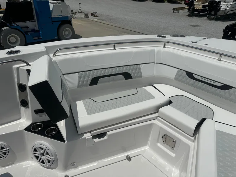 Slide: The Image of 2025 Blackfin 302 CC boat interior with white and gray seating. - 22