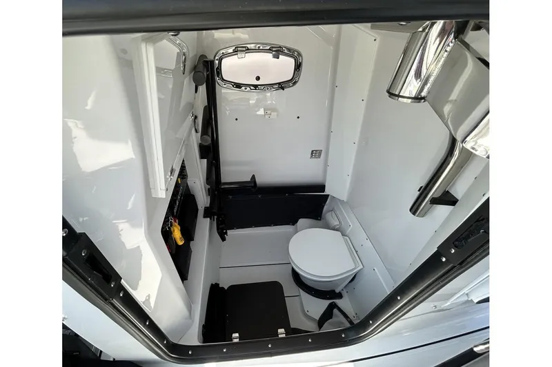 Slide: The Image of 2025 Blackfin 302 CC boat interior cabin with toilet and storage. - 8