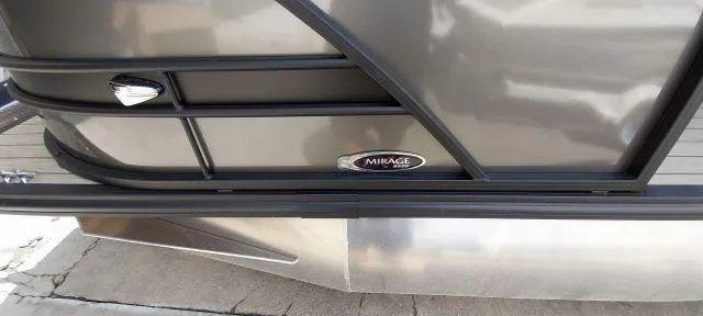 Slide: The Image of 2024 Sylvan Mirage 8520 CLZ DH pontoon boat side view with logo detail. - 13