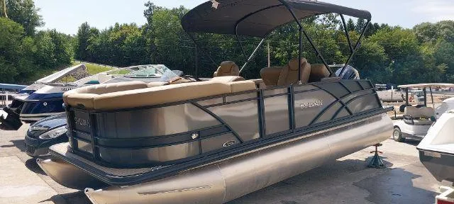 Slide: The Image of 2024 Sylvan Mirage 8520 CLZ DH pontoon boat with canopy, parked outdoors. - 14