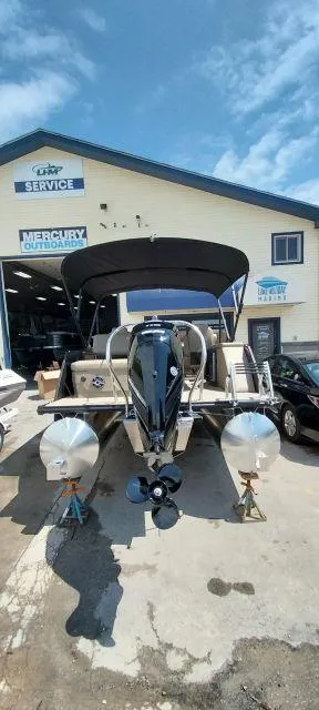 Slide: The Image of 2024 Sylvan Mirage 8520 CLZ DH pontoon boat at a service center. - 4