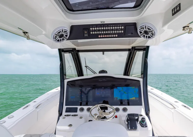 Slide: The Image of 2026 Blackwater 41 Sportfish helm with advanced navigation system on open sea. - 14