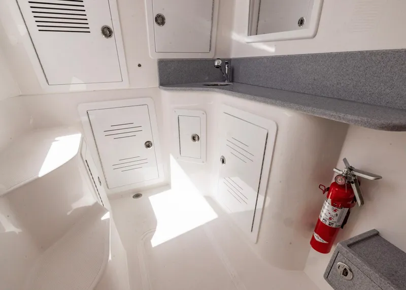 Slide: The Image of Interior of 2026 Blackwater 41 Sportfish boat with storage cabinets and fire extinguisher. - 27