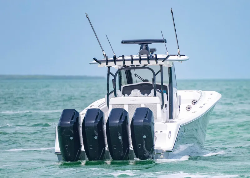 Slide: The Image of 2026 Blackwater 41 Sportfish boat with four engines cruising on open water. - 3