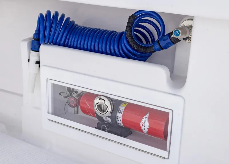 Slide: The Image of Blue coiled hose and fire extinguisher on 2026 Blackwater 41 Sportfish boat. - 31