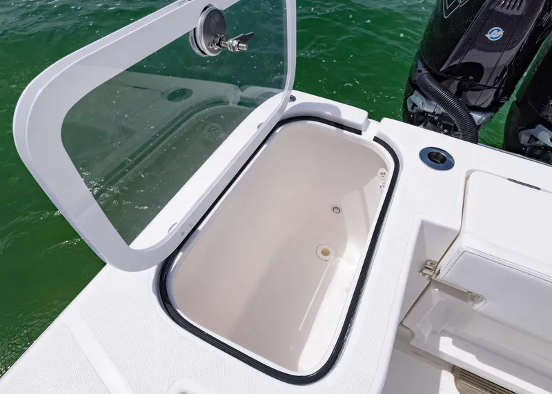 Slide: The Image of Open storage compartment on 2026 Blackwater 41 Sportfish boat, with visible outboard motors. - 37