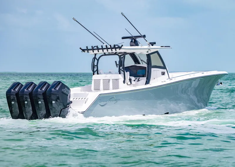 Slide: The Image of 2026 Blackwater 41 Sportfish boat cruising on clear blue waters. - 40