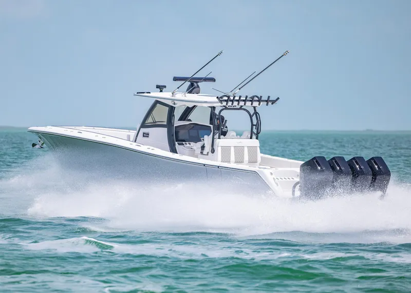 Slide: The Image of 2026 Blackwater 41 Sportfish boat speeding on open water, showcasing powerful engines. - 45
