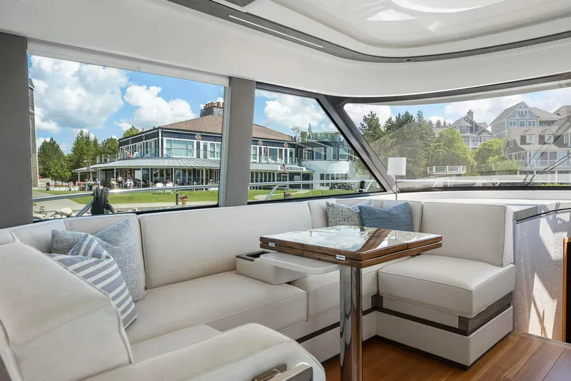 Slide: The Image of Luxurious interior of 2022 Tiara Yachts C49 Coupe with elegant seating and scenic view. - 23