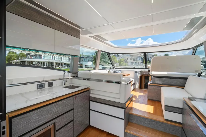 Slide: The Image of 2022 Tiara Yachts C49 Coupe interior with modern design and panoramic windows. - 24