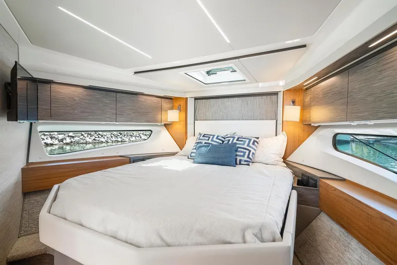 Slide: The Image of Luxurious bedroom interior of 2022 Tiara Yachts C49 Coupe with modern design and natural light. - 33