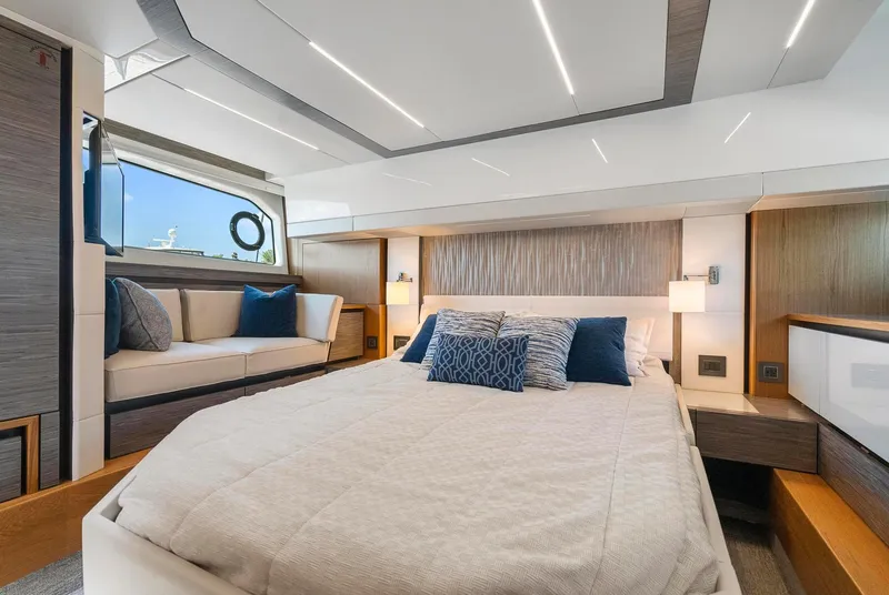 Slide: The Image of Luxurious bedroom interior of 2022 Tiara Yachts C49 Coupe with modern design and cozy seating. - 40