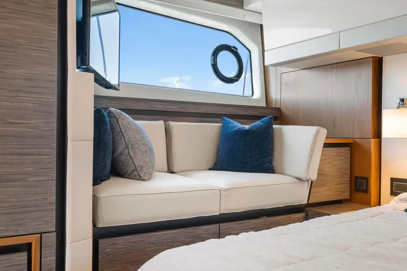 Slide: The Image of Luxurious interior of 2022 Tiara Yachts C49 Coupe with elegant seating and window view. - 41