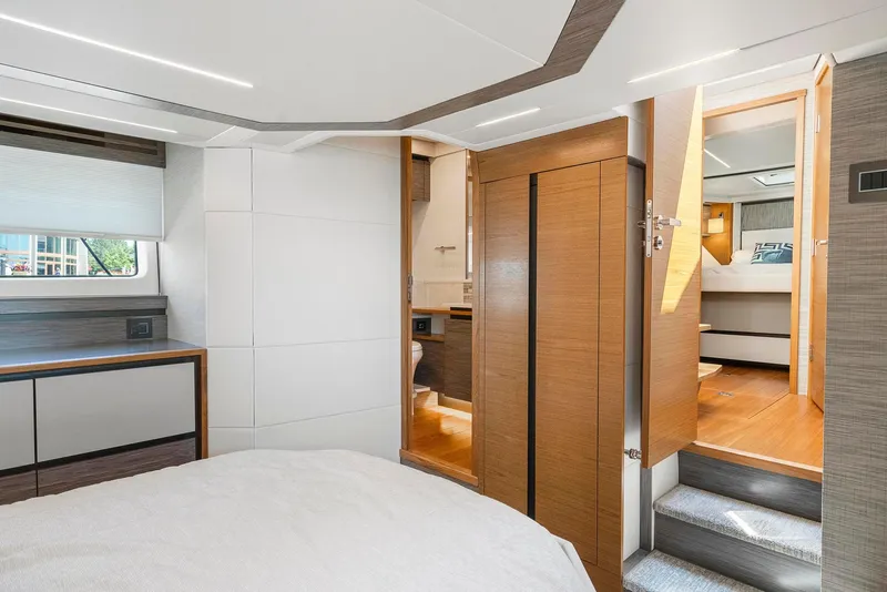 Slide: The Image of 2022 Tiara Yachts C49 Coupe interior with modern design and wooden accents. - 44