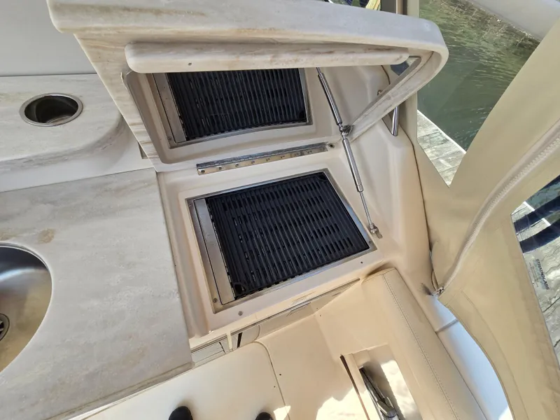 Slide: The Image of Outdoor grill and sink on 2017 Grady-White Freedom 335 boat deck. - 10