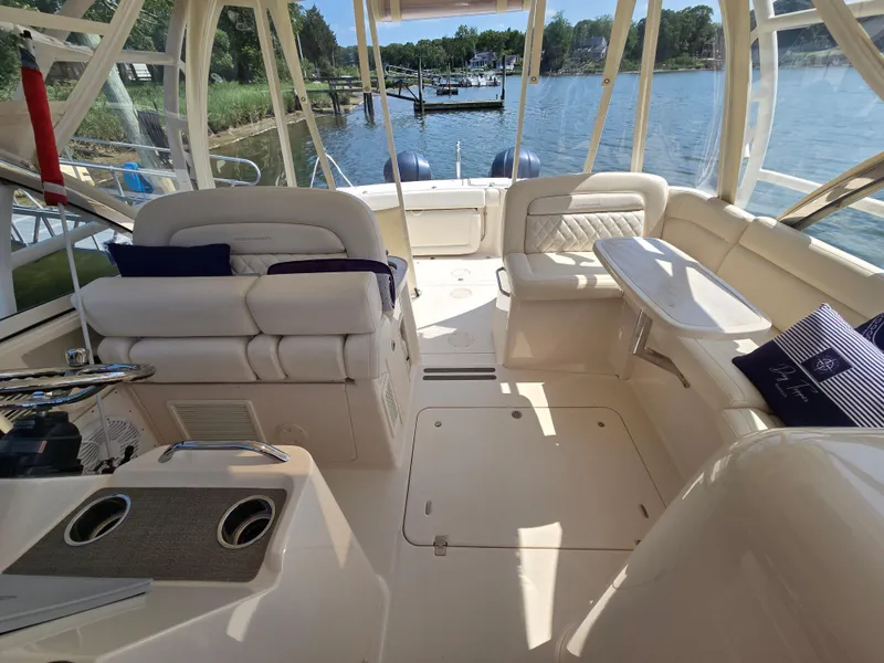 Slide: The Image of 2017 Grady-White Freedom 335 boat interior with seating and water view. - 12