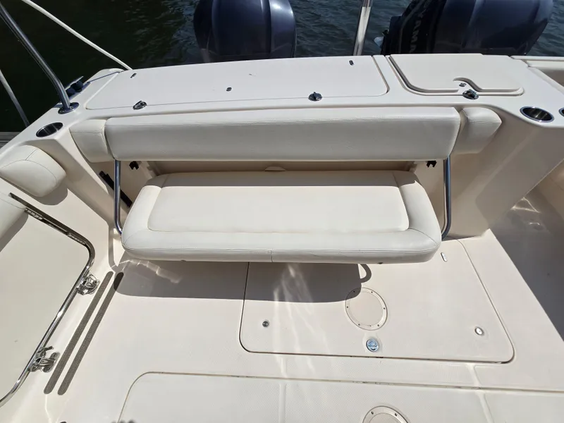 Slide: The Image of 2017 Grady-White Freedom 335 boat interior with foldable seating and dual engines. - 7