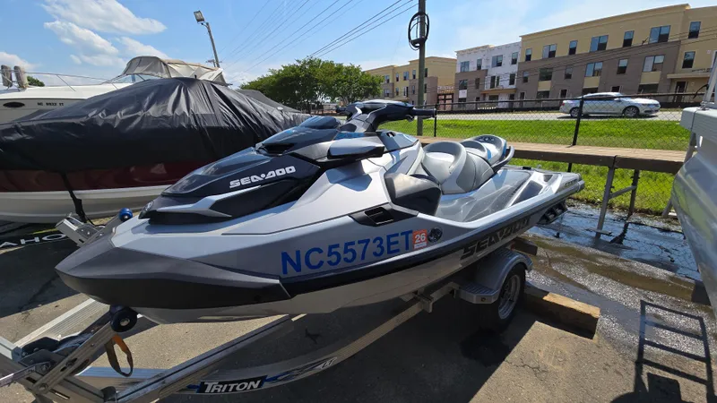 The Image of 2021 Sea-Doo GTX Limited 300 jet ski on trailer, parked outdoors. - 0