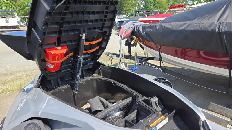 Slide: The Image of Open storage compartment of 2021 Sea-Doo GTX Limited 300, showcasing interior space and accessories. - 15
