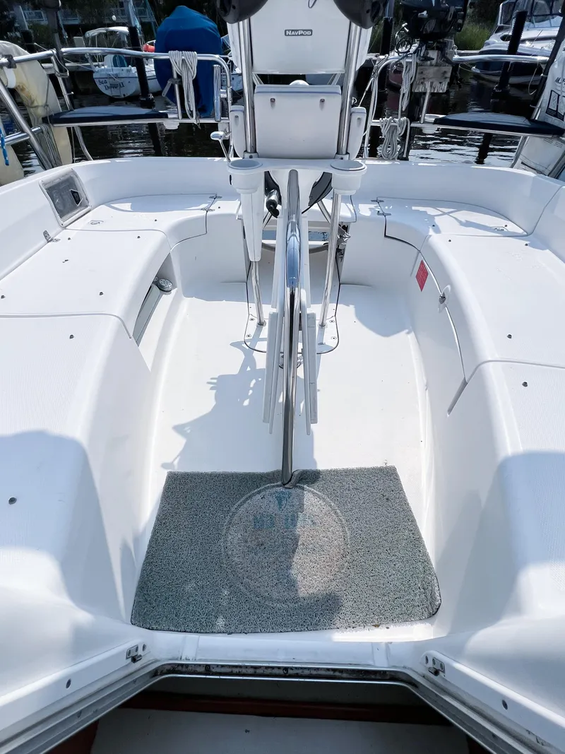 Slide: The Image of Cockpit of a 2002 Hunter 356 sailboat with steering wheel and seating. - 10