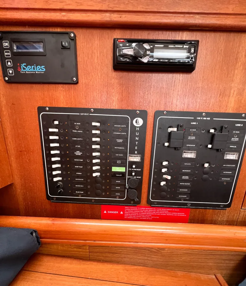 Slide: The Image of Control panel of a 2002 Hunter 356 sailboat with switches and displays. - 34