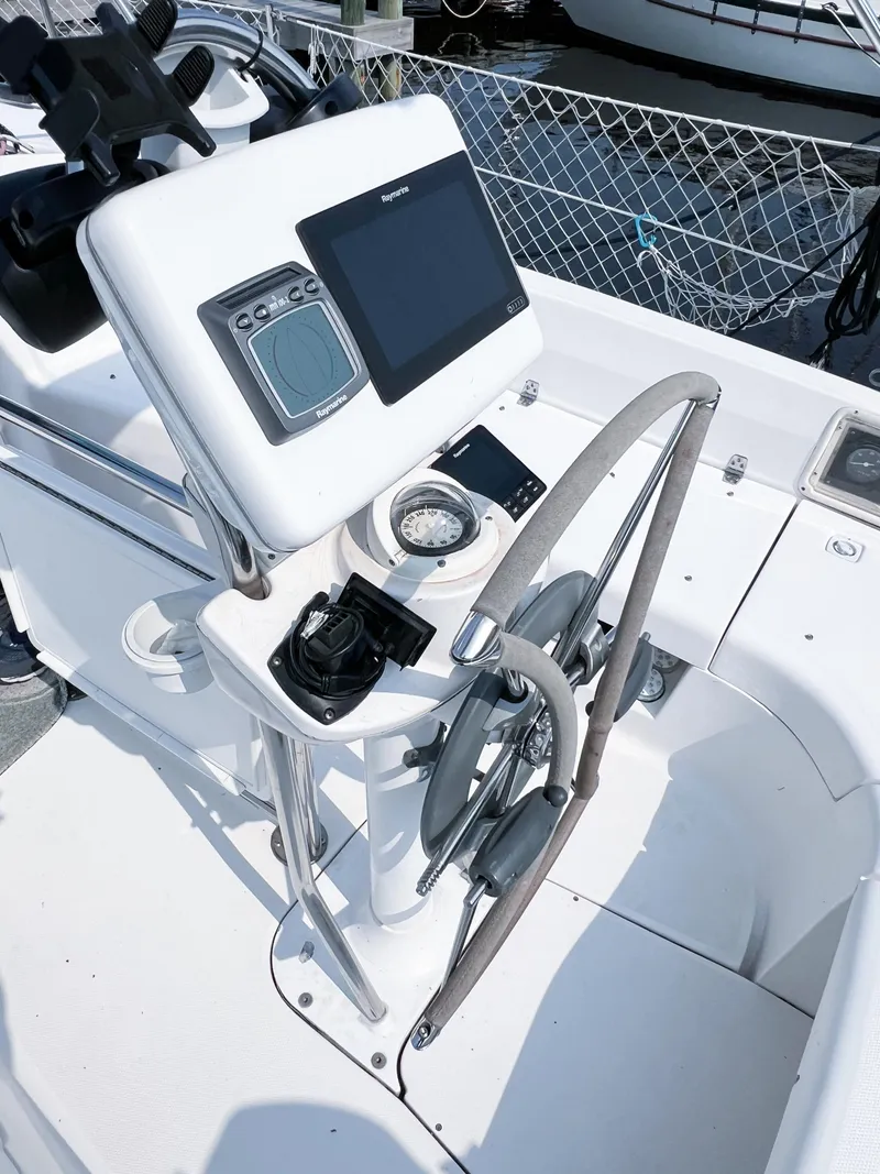 Slide: The Image of Steering console of a 2002 Hunter 356 sailboat with navigation equipment. - 4