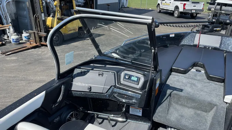 Slide: The Image of 2025 Skeeter Solera 205 boat interior with dashboard and seating area. - 3