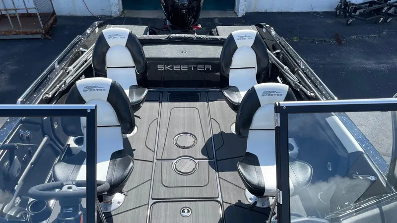 Slide: The Image of 2025 Skeeter Solera 205 boat interior with seating and steering wheel. - 7