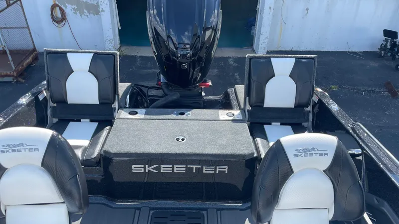 Slide: The Image of 2025 Skeeter Solera 205 boat interior with black and white seating and motor. - 9