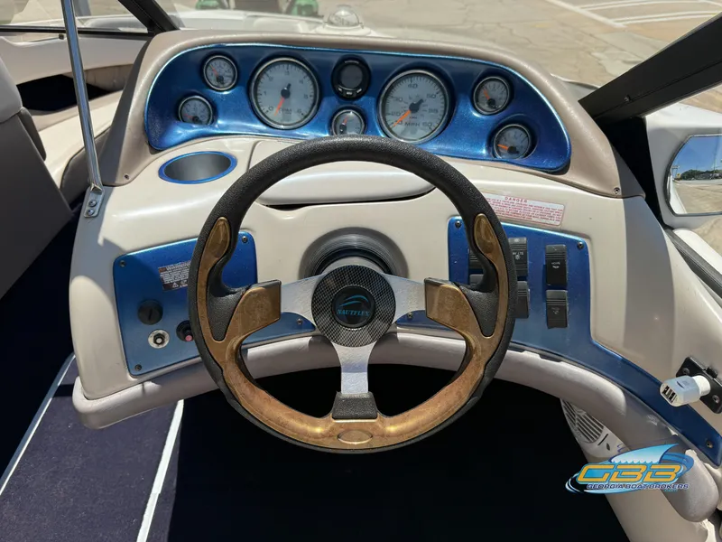 Slide: The Image of Steering wheel and dashboard of a 1998 Regal 2100 LSR boat. - 10