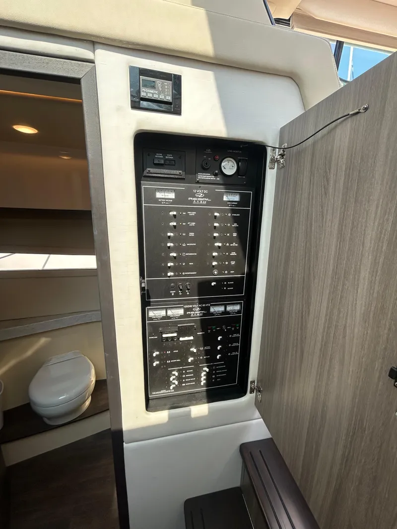 Slide: The Image of Electrical panel inside 2020 Regal 38 Grande Coupe yacht cabin. - 19