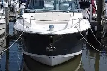 Slide: The Image of 2020 Regal 38 Grande Coupe docked at marina, front view. - 2
