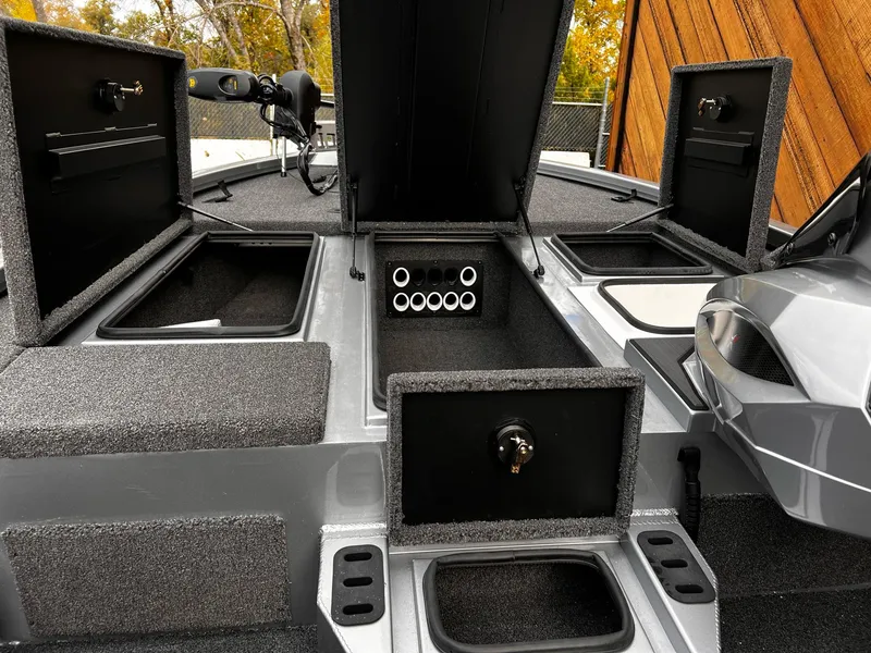 Slide: The Image of 2024 Vexus AVX1880 boat interior with open storage compartments and sleek design. - 13