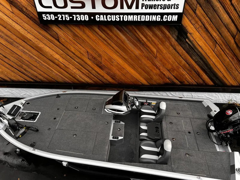 Slide: The Image of 2024 Vexus AVX1880 boat with dual seats, gray deck, and outboard motor. - 5