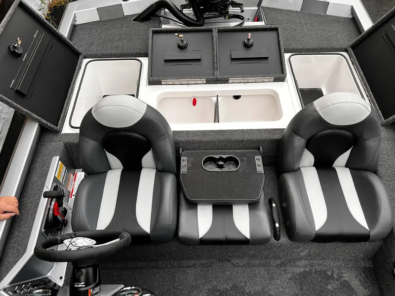 Slide: The Image of 2024 Vexus AVX1880 boat interior with seating, storage compartments, and steering wheel. - 9