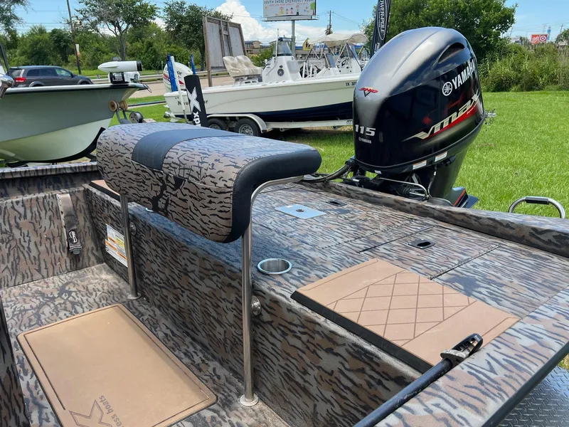 Slide: The Image of 2022 Xpress H190B boat with Yamaha 115 engine, camo design, outdoor display. - 5