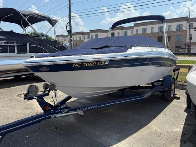 The Image of 2005 Four Winns 190 Horizon boat on trailer, covered and parked outdoors. - 0