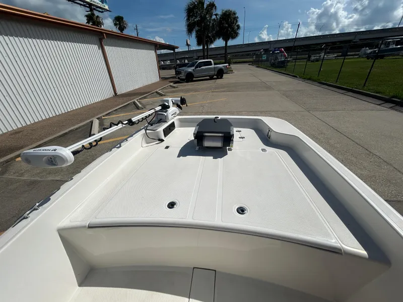 Slide: The Image of 2020 Mako Pro Skiff 17 CC boat with trolling motor in parking lot. - 14