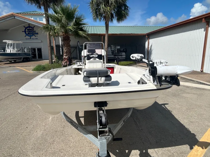 Slide: The Image of 2020 Mako Pro Skiff 17 CC boat on trailer, parked outdoors. - 2