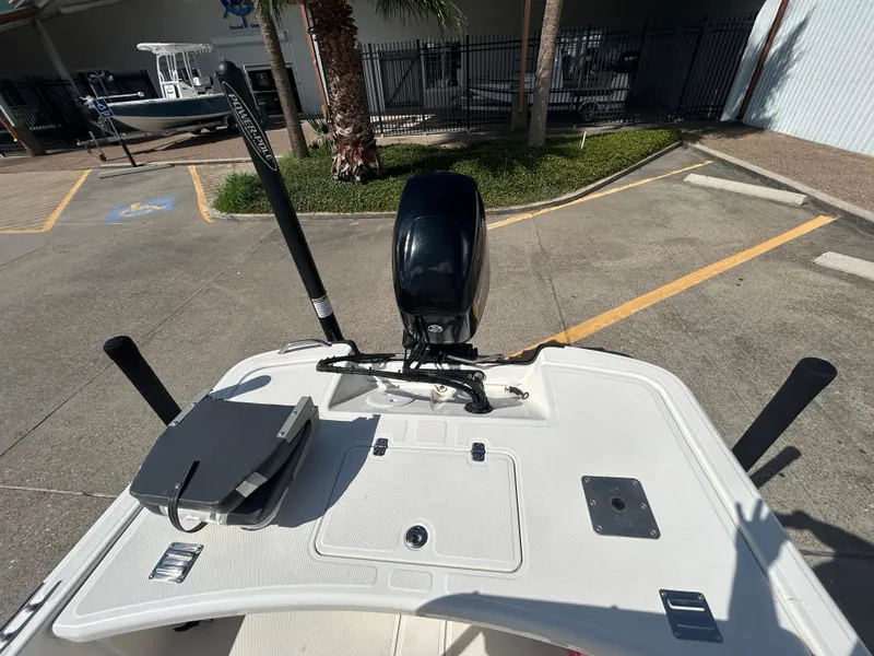 Slide: The Image of 2020 Mako Pro Skiff 17 CC boat with motor, parked outdoors. - 7