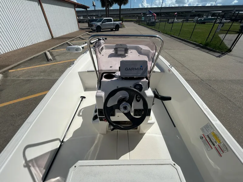 Slide: The Image of 2020 Mako Pro Skiff 17 CC boat interior with Garmin navigation system. - 9